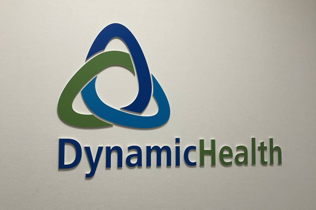 dynamic health stand off wall sign